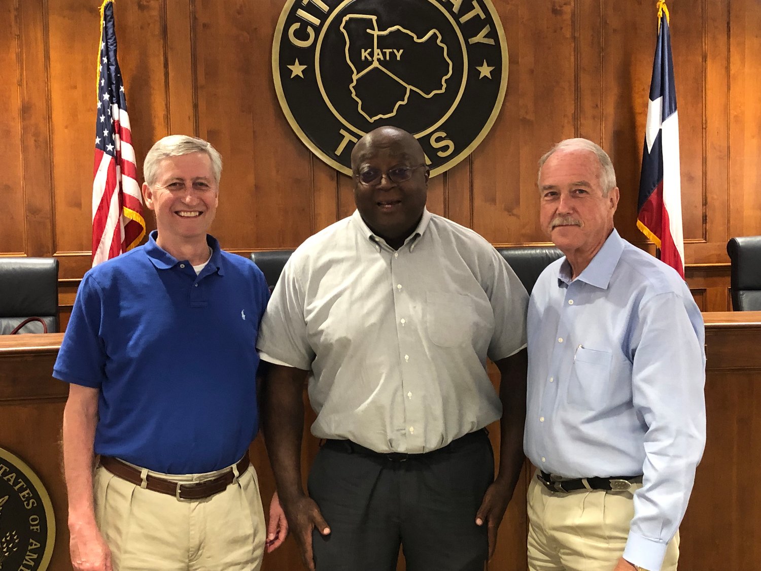 Mayor-Elect Dusty Thiele, City Attorney Art Pertile, and Mayor Bill Hastings pose together following Monday's Katy City Council meeting at City Hall.